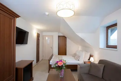 a living room with a couch and a table at House Klasika - Adults Only in Bled