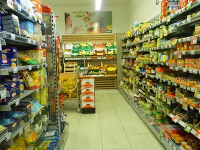 a store aisle of a grocery store filled with food at Vila Silva Marija Apartments in Pišece