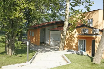 a house with a walkway in front of it at Garni Hotel Siesta in Nova Gorica