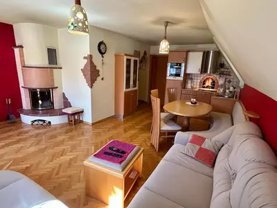 a living room with a couch and a table at Apartment Crystal Rose in Kranjska Gora