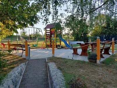 a park with a playground with a slide at Guesthouse Mesec Zaplana in Vrhnika