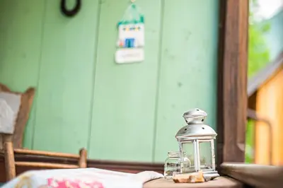 a glass lantern sitting on top of a table at Vintage House Podliparska in Fara