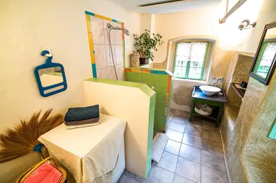 a bathroom with a sink and a toilet in it at Vintage House Podliparska in Fara