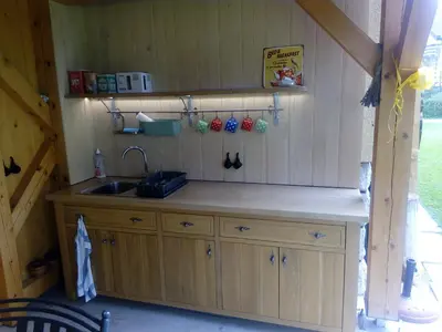a kitchen with a sink and a counter at Green Garden Apartment in Bled