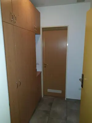 an empty room with a closet and a door at Victoria Apartment in Ljubljana
