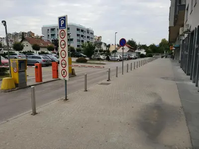 a parking lot with a parking sign on a street at Victoria Apartment in Ljubljana