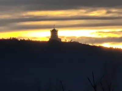 a silhouette of a building on a hill at sunset at Bed and Breakfast Kogoj in Nova Gorica