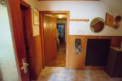 a hallway of a room with a door and a room with at Apartment Jorsi with Mountain View in Zreče