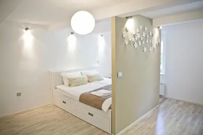 a bedroom with a bed in a room at Apartments Hiša Pod Gradom in Ljubljana