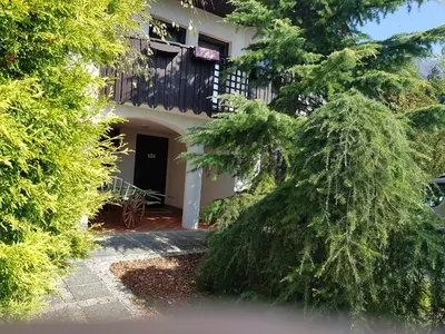a house with a tree in front of it at Pr'Simi in Golnik