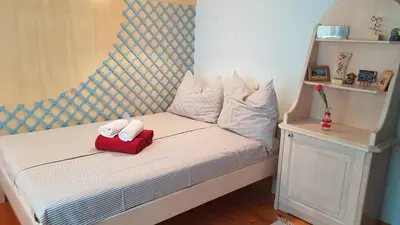 a small bed with two towels on top of it at Pr'Simi in Golnik