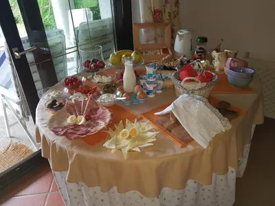 a table with food and other items on it at Pr'Simi in Golnik