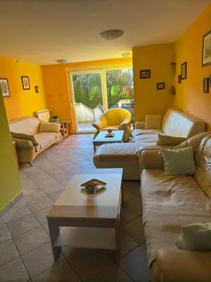 a living room with couches and a coffee table at Sobe- Rooms - Apartments - Free parking! in Maribor