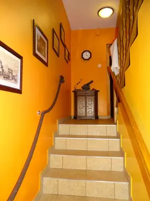 a staircase in a house with orange walls at Sobe- Rooms - Apartments - Free parking! in Maribor