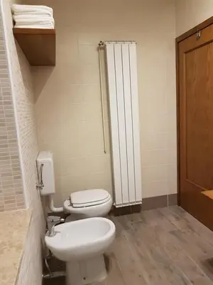 a bathroom with a toilet and a sink at Apartment Slavi in Vipava
