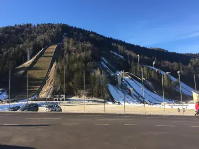 a ski slope on a hill with a ski lift at gostišče uh- planica in Rateče