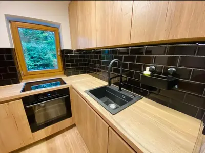 a kitchen with a sink and a window at Chalet Jasmin in Bohinj