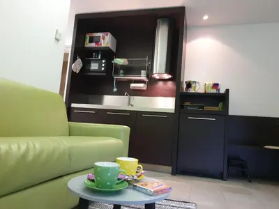 a living room with a couch and a table at Apartma Kurji vrh - Chicken top in Kranjska Gora