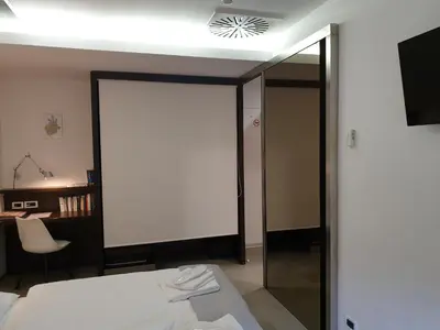 a bedroom with a bed and a sliding glass door at Apartma Kurji vrh - Chicken top in Kranjska Gora