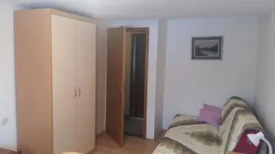 a living room with a couch and a closet at apartma Albina in Kranjska Gora