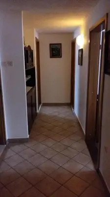 an empty room with a kitchen and a hallway at apartma Albina in Kranjska Gora