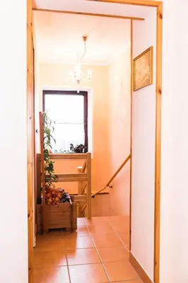 a hallway with a door leading into a room at Počitniška hiša Pologar in Tolmin