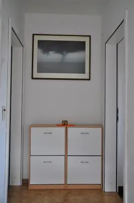 a room with a dresser and a picture on the wall at Apartma BAJČI in Ajdovščina