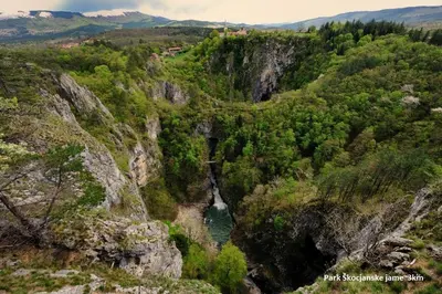 an aerial view of a mountain valley with a river at Guesthouse Risnik in Divača
