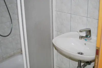 a bathroom with a sink and a shower at Farm Stay Bogša in Ormoz