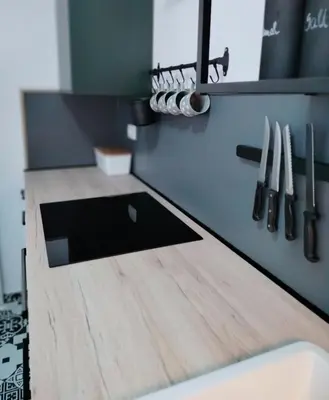 a kitchen with a wooden counter top with a sink at Naturalina in Tolmin