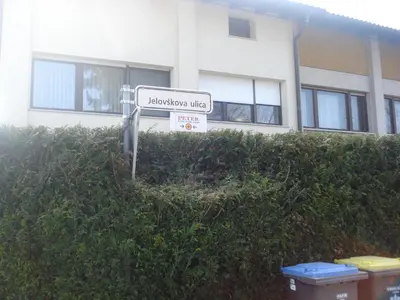 a sign in front of a building at Peter rooms in Ljubljana