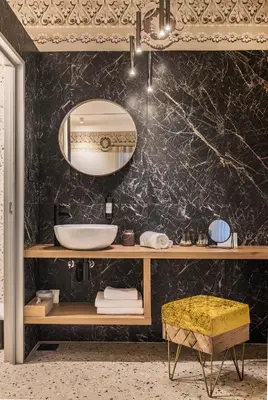 a bathroom with a sink and a mirror at Hotel Pok Garni in Brezovica