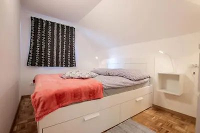 a bedroom with a bed and a window at Apartment Amazing View in Bohinj
