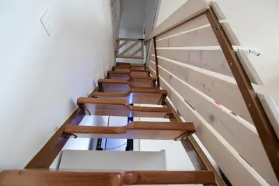 a row of wooden stairs in a room at Apartment Amazing View in Bohinj