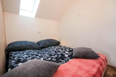 a bed with pillows on it in a bedroom at Apartment Amazing View in Bohinj