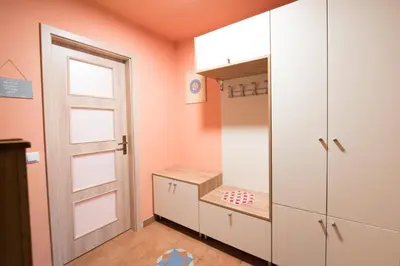 a childs room with pink walls and a door at Apartment Tiara 2 in Rodine