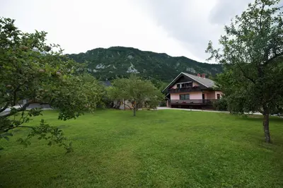 a large yard with a house in the background at Apartment Tiara 2 in Rodine