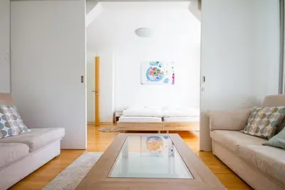 a living room with a couch and a coffee table at Apartma in Ormoz