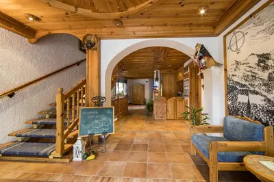 an entrance to a house with an archway and stairs at Garni Hotel Berc in Bled