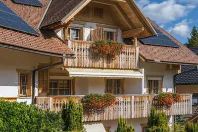 a house with solar panels on its windows at Garni Hotel Berc in Bled