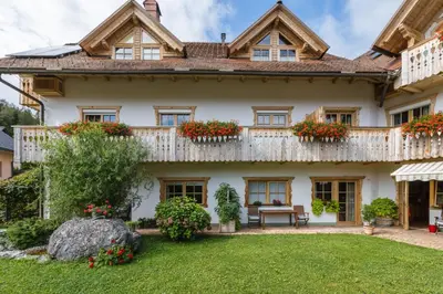 an exterior view of a house with a balcony at Garni Hotel Berc in Bled
