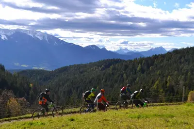 a group of people riding bikes on a hill at BikeSki family hotel, b&b, apartaments, rooms in Mežica