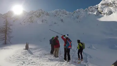 a group of people standing on a snow covered mountain at BikeSki family hotel, b&b, apartaments, rooms in Mežica