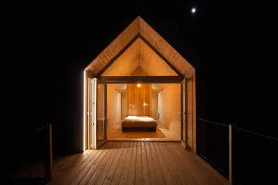 a room with a bed in the middle of a hallway at Kamp Koren Kobarid in Kobarid