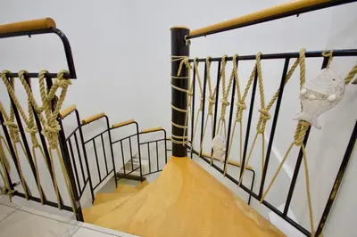 a stairwell with a wooden board on it at Blue Point Apartment Ljubljana in Ljubljana