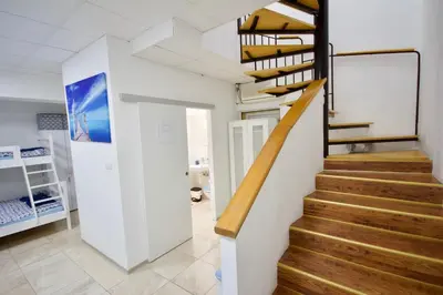a staircase in a house with wooden treads at Blue Point Apartment Ljubljana in Ljubljana