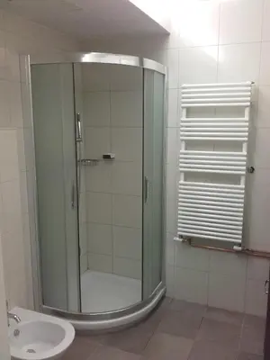 a glass shower in a bathroom with a toilet at klass 203 in Kranjska Gora