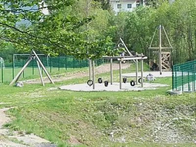 a playground with a swing set in a park at klass 203 in Kranjska Gora