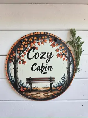 a sign hanging on a wall with a bench at Cozy Cabin in Čatež ob Savi