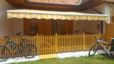 two bikes parked on a fence in front of a house at TULPIKA 13 in Moravske Toplice
